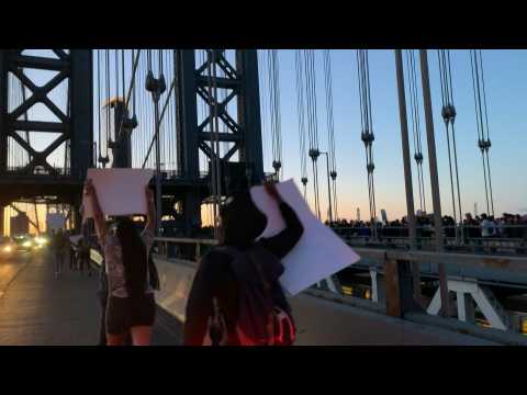 Anti-racism protestors cross Manhattan Bridge in New York
