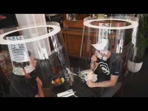 French designer creates plexiglass bubbles to protect diners from coronavirus