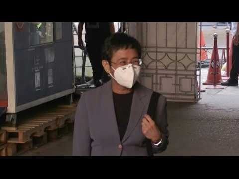 Philippine journalist Ressa arrives in court for verdict