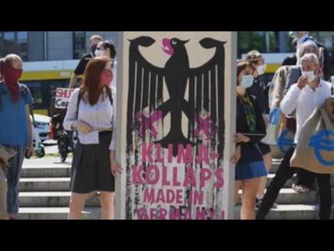 Extinction Rebellion holds protest in Berlin calling for net-zero carbon emissions