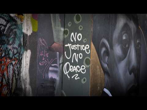 Toronto graffiti artists "paint the city black" against racism