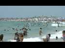 Florida residents head to the beach despite virus surge
