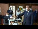 Masked Macron and wife Brigitte vote in French local elections