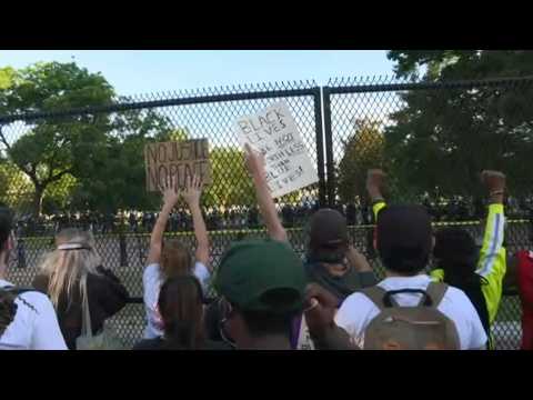 Protesters rally outside the White House as curfew begins