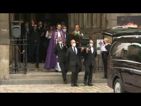 Coffin of French actor Guy Bedos carried out of church