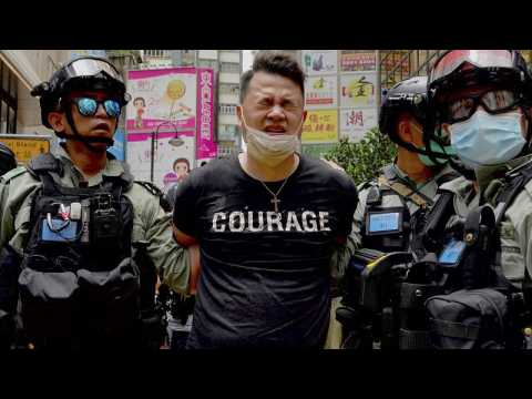Hong Kong police make 'dozens of arrests' under new security law