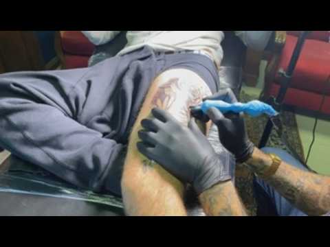 Tattooists in South Africa return to work amid pandemic