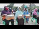 Aid distribution and disinfection in Jakarta shanty town