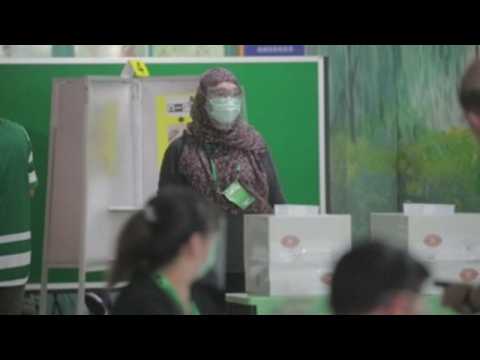 Singaporeans go to polls amid coronavirus pandemic