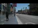 Few Angelenos walk Hollywood Boulevard as California eases lockdown