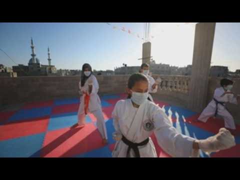Palestinian karate coach trains with his family amid lockdown