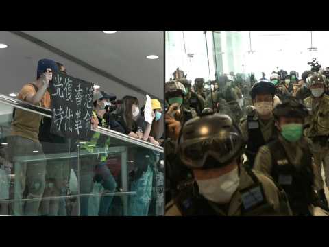Riot police chase Hong Kong Mother's Day protesters