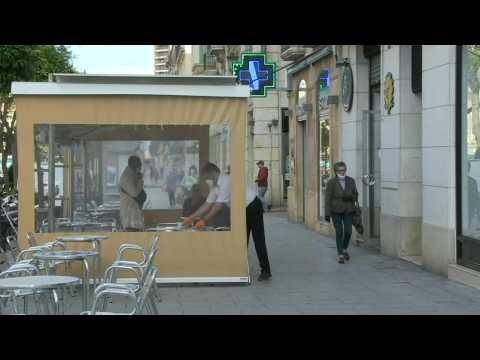 People sit at cafes in Spain's Tarragona, as country eases virus lockdown