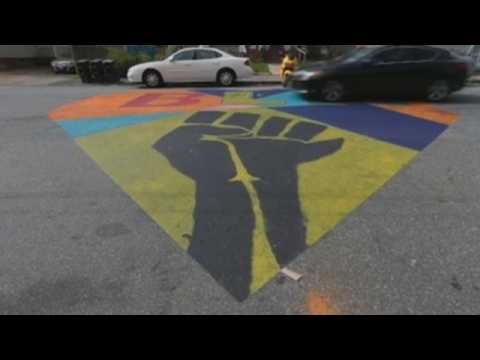 Visual artist Leigh Bigger paints Black Lives Matter mural in Massachusetts