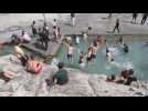 Iranian families enjoy the good weather at Shahre-Ray pools