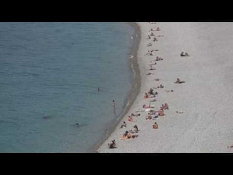 Dozens gather at reopened Nice beaches