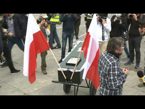 People rally against coronavirus restrictions in Warsaw