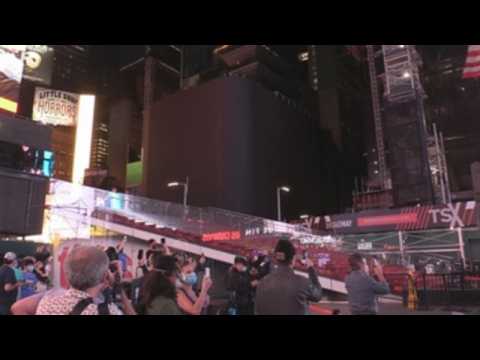 New York Times Square momentarily goes dark to show support for hospitality businesses