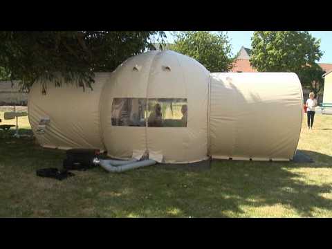 Coronavirus: French nursing home's special tent lets elderly have visitors again