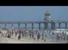 Beachgoers enjoy sand and sun in California on Memorial Day