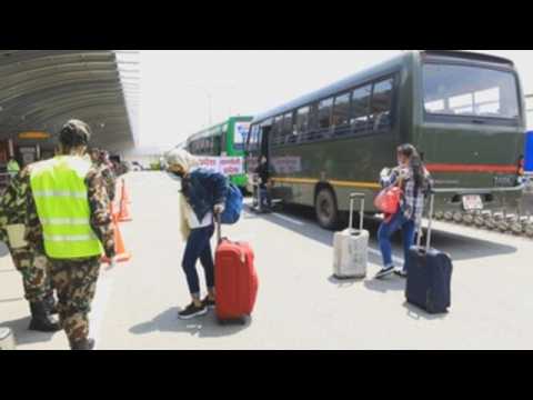 Nepalese migrant workers arrive in Kathmandu