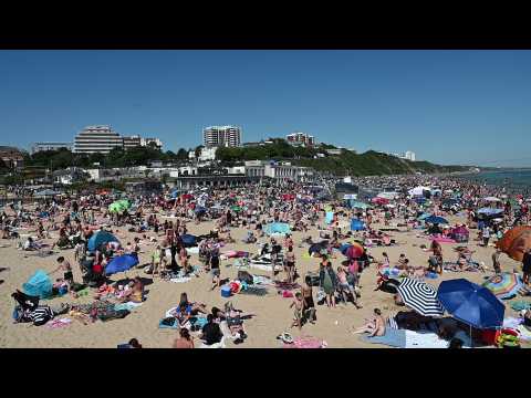 Thousands flock to English beach town as heatwave hits restriction-weary Europe