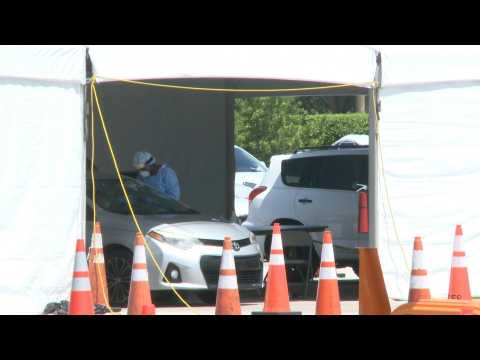 Miami: people wait at drive-through coronavirus testing site as cases surge