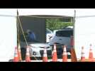 Miami: people wait at drive-through coronavirus testing site as cases surge