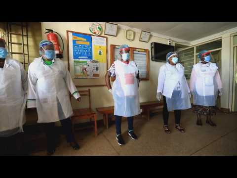 Young unemployed workers make protective masks in Nairobi