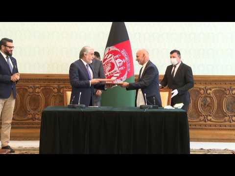 Afghan President Ghani and rival Abdullah sign power-sharing deal