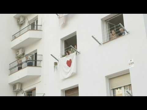 In Barcelona, people clap from balconies for healthworkers