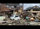 Destruction and debris on streets after deadly floods in Japan