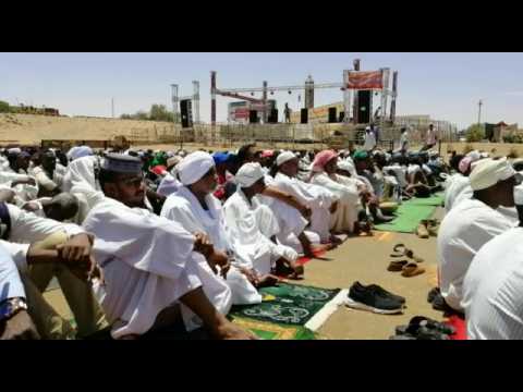 Sudanese protesters take part in the Friday prayers near army HQ