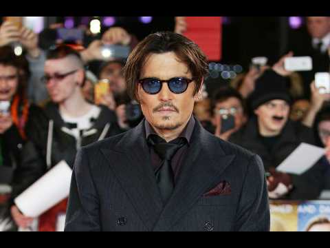 Johnny Depp: Amber Heard 'painted on bruises' for court appearance