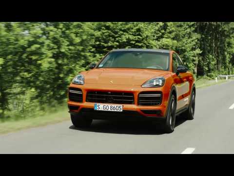 The new Porsche Cayenne Turbo Coupé in lava orange Driving Video
