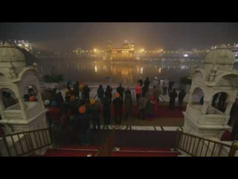 Devotees offer prayers at the Golden Temple on New Year Day 2021 in Amritsar