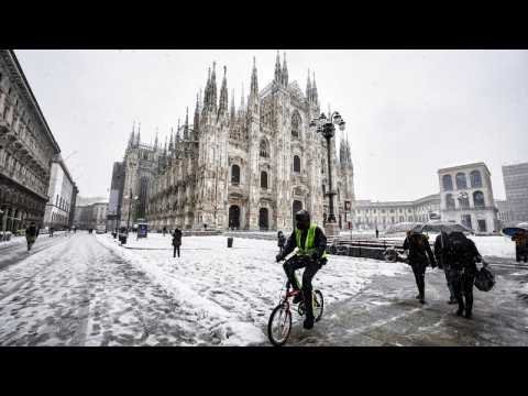 Heavy snow coats Milan in white but disrupts city traffic