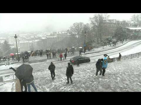 Views from Montmartre show Paris covered in snow