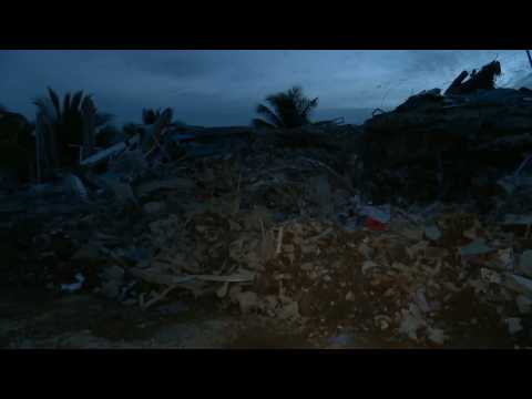 Nightfall at Indonesian hospital flattened by quake