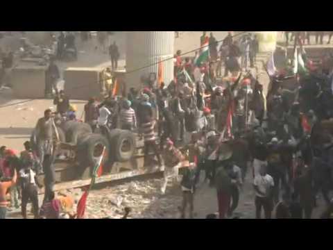 Riot breaks out at India tractor rally as farmers breach police barricades