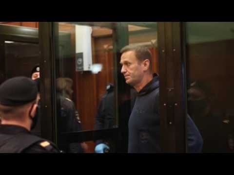 Russian opposition leader Alexei Navalny sits before judiciary