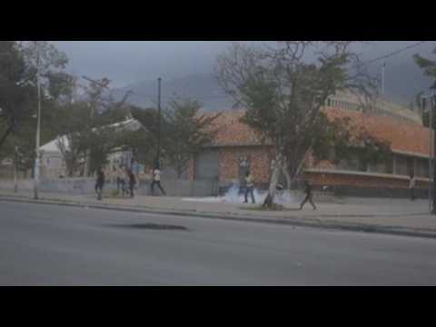 Police in Haiti use tear gas to disperse protesters outside National Palace