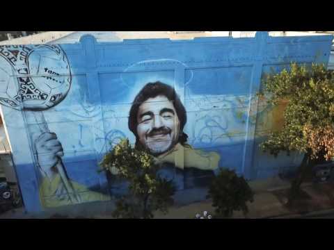 Street artist unveils mural to 'Saint' Diego Maradona