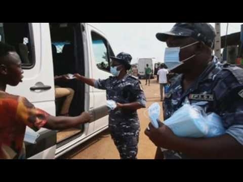 Ivory Coast authorities hand out face masks to encourage their use