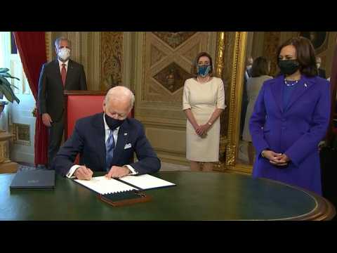 Biden signs his first official documents as US President