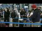 People queue inside Chicago airport to travel for holidays amid pandemic