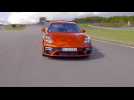 The new Porsche Panamera Turbo S in Papaya Metallic Track Driving