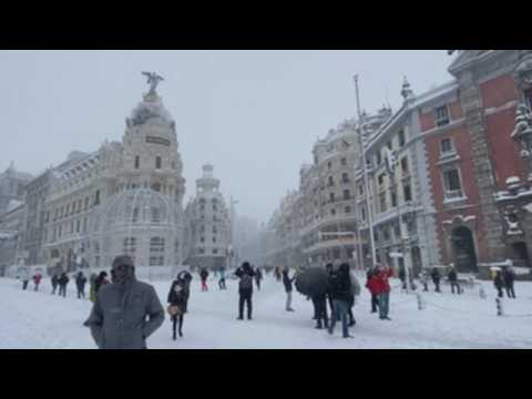 Madrid residents enjoy day out in snow-covered city centre
