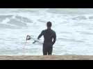 Surfers in Barcelona make the most of storm Filomena
