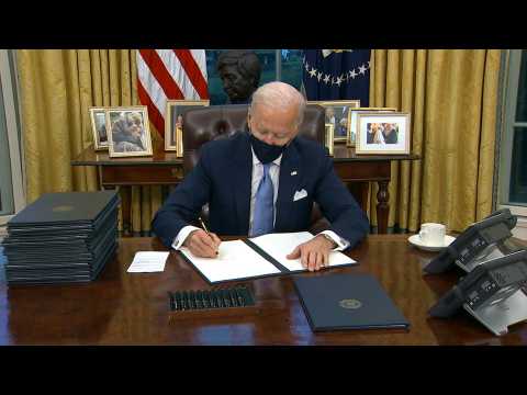Biden signs series of orders, including to rejoin Paris climate accords